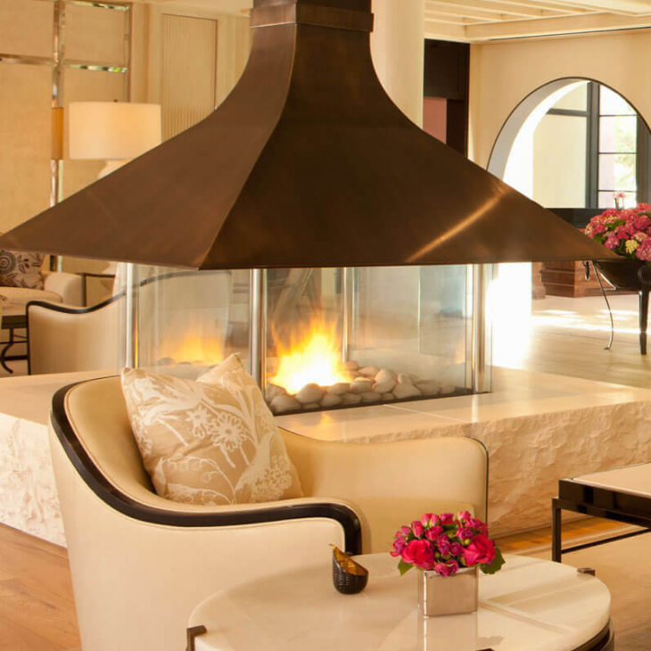 A living room with a fireplace and a chair