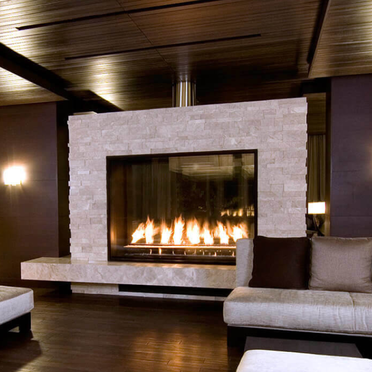 A living room with a fireplace and a couch