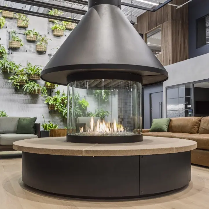 A fireplace in a living room surrounded by furniture