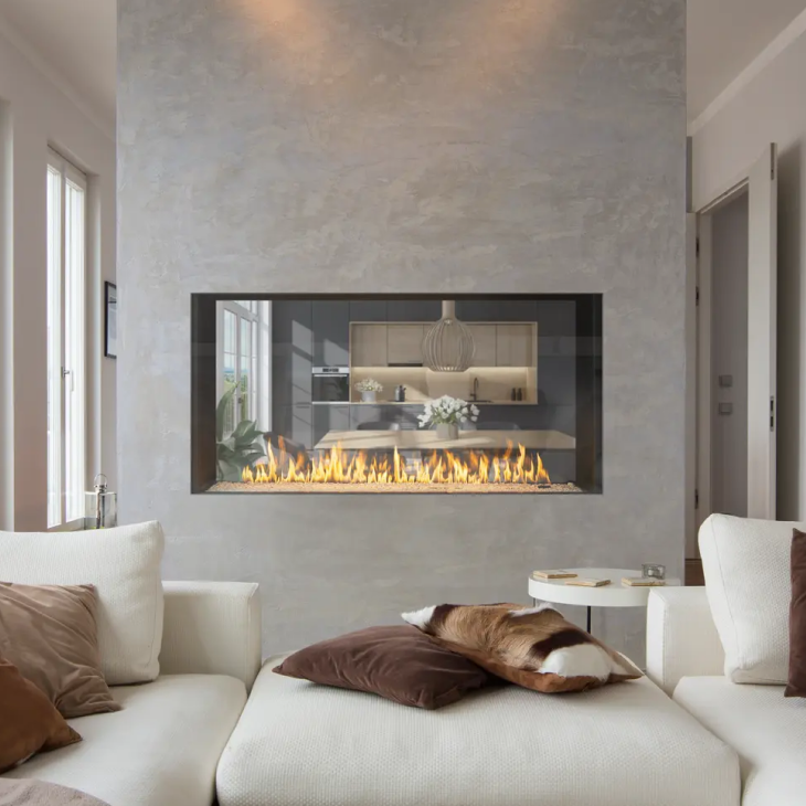 A living room with a fireplace and a couch
