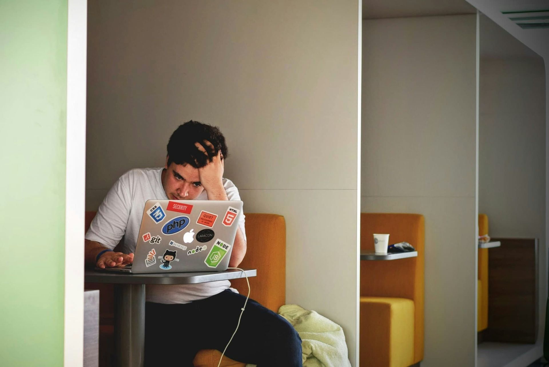A stressed man working at a computer