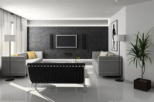 Modern gray living room with sectional sofa, wall-mounted TV, and large potted plant