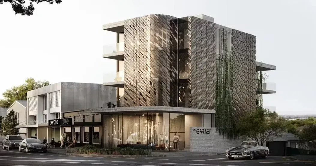 Modern multi-story building with wood slat facade, large windows, and landscaped street frontage