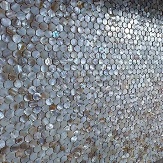 Close-up of a wall covered in tightly packed silver bottle caps
