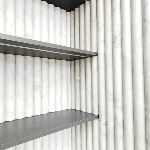 Empty white shelves in a gray storage cabinet
