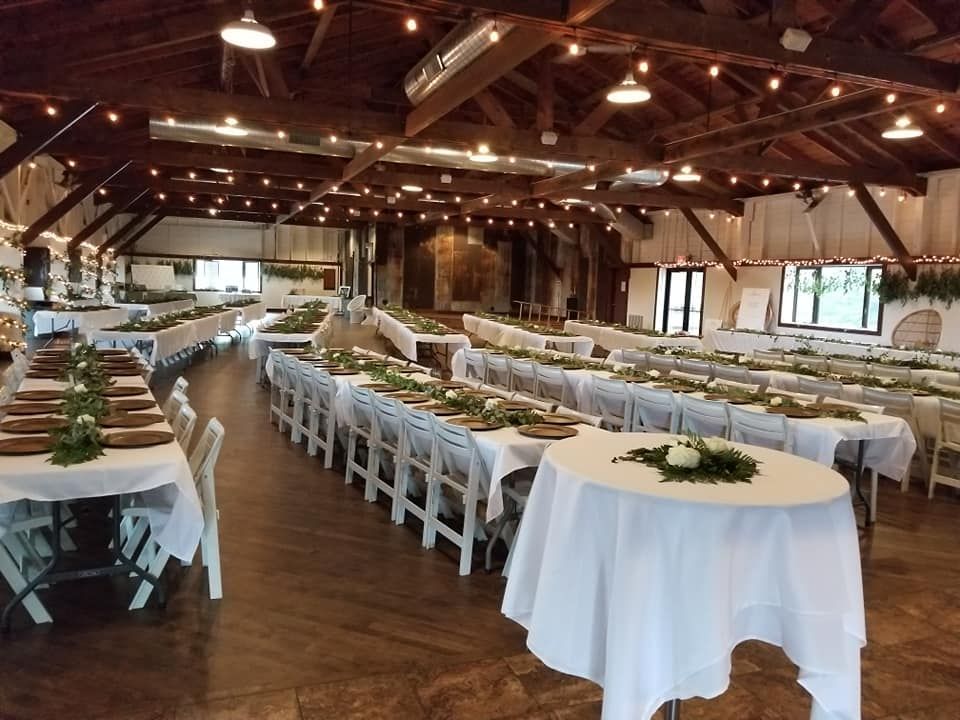 Tables and chairs set up for a wedding