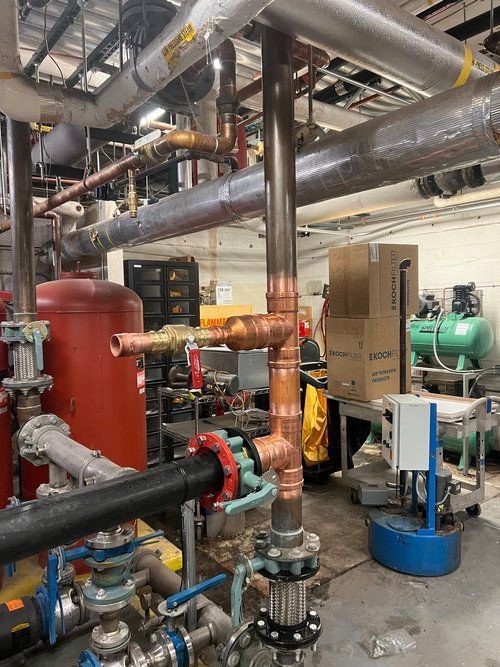 A room filled with lots of pipes and valves.