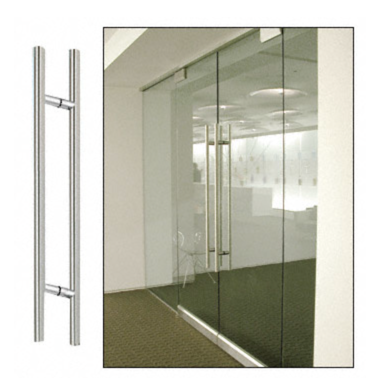 Stainless steel door pull handles on a glass door. Interior shot of a modern office.