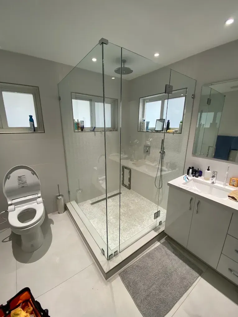 Custom Frameless Shower Enclosure with Premium Hardware installed during a residential bathroom renovation in Cutler Bay.