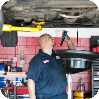 Our Technician Checks a Vehicle in Cape Coral, FL - George's Complete Auto Repair