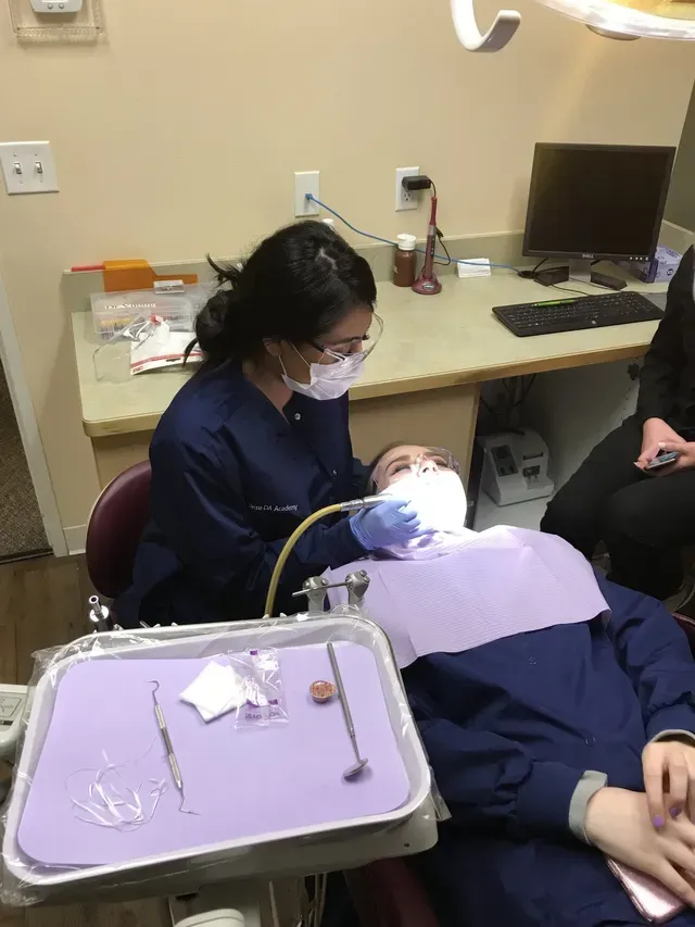 Dental Assistant working on patient