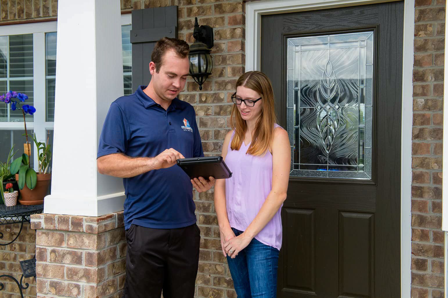 air solutions hvac business owner phillip discussing HVAC services with a client