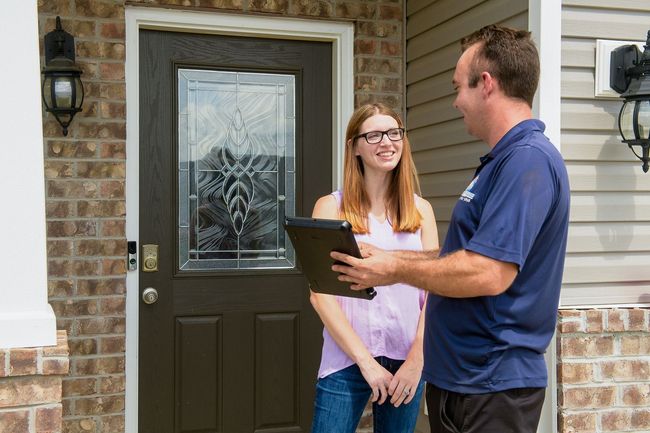 air solutions hvac business owner phillip discussing HVAC services with a client