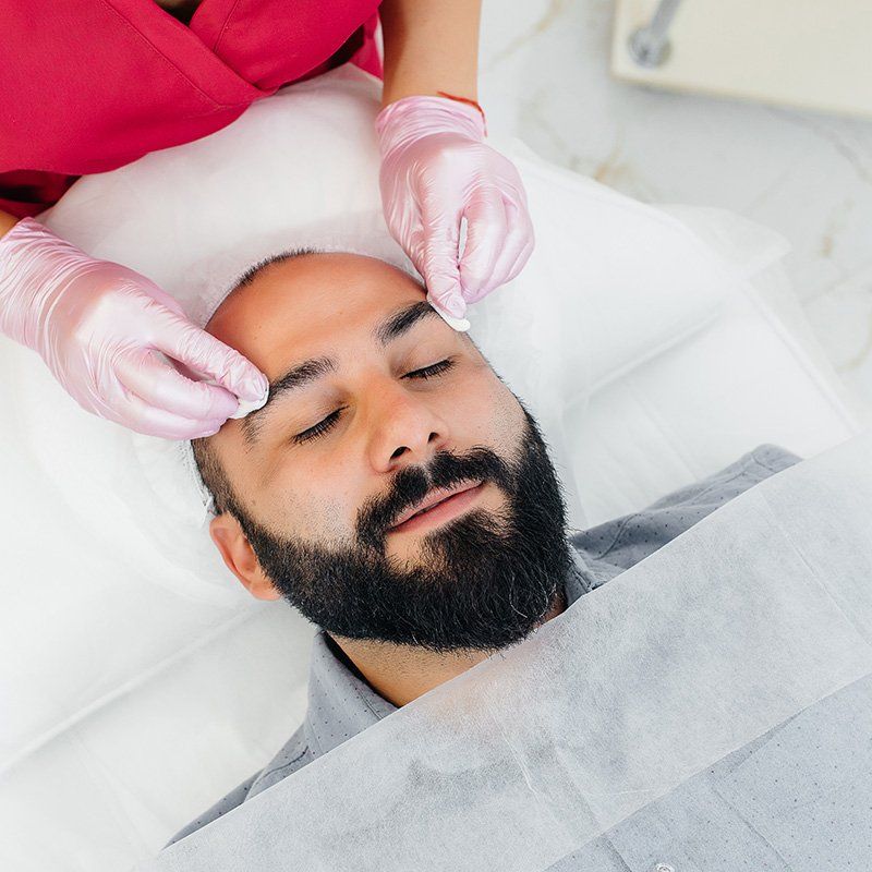 man getting a facial