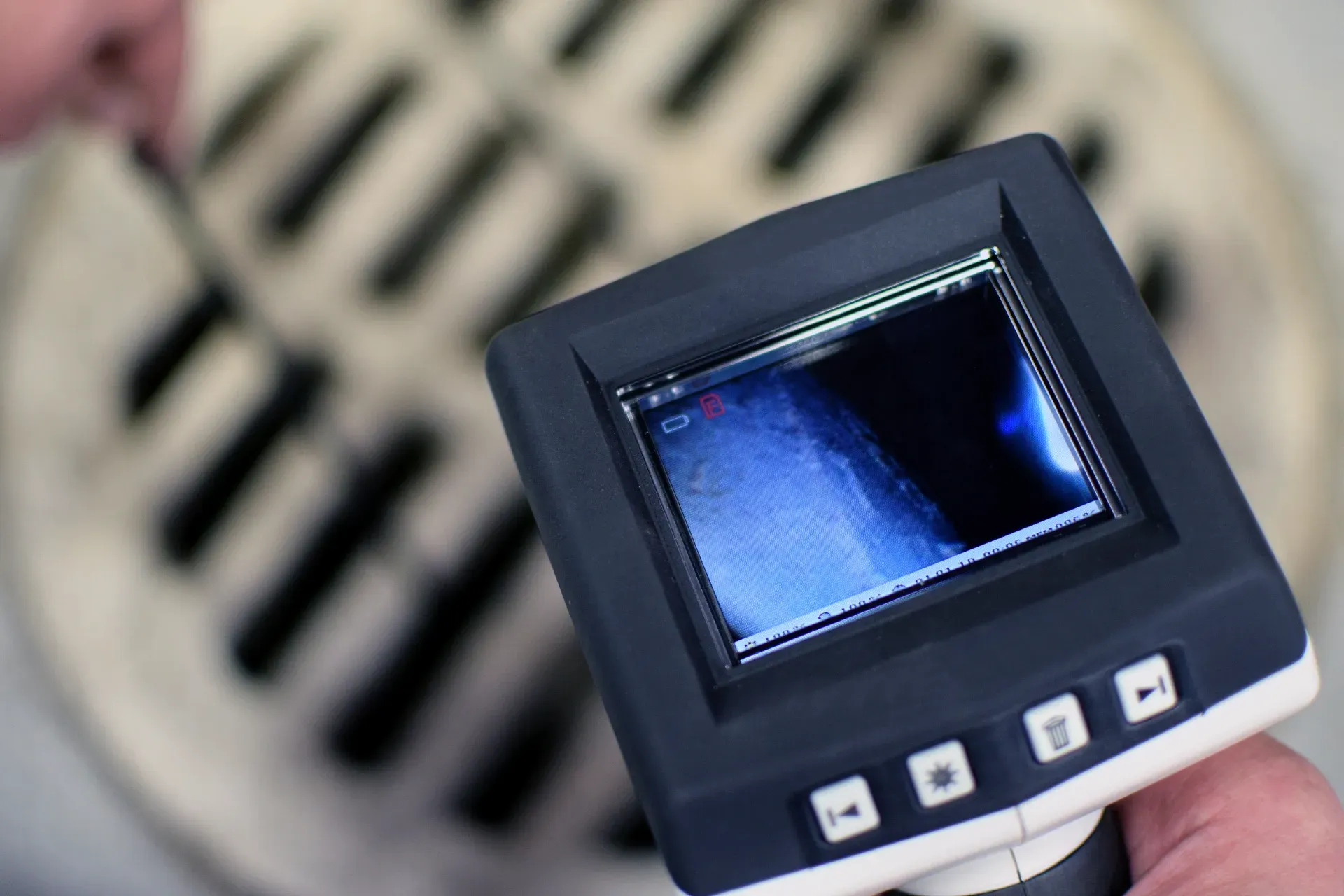 Handheld thermal camera aimed at a vent, showing blue heat on the screen — New Gen Plumbing and Gas in Pottsville, NSW