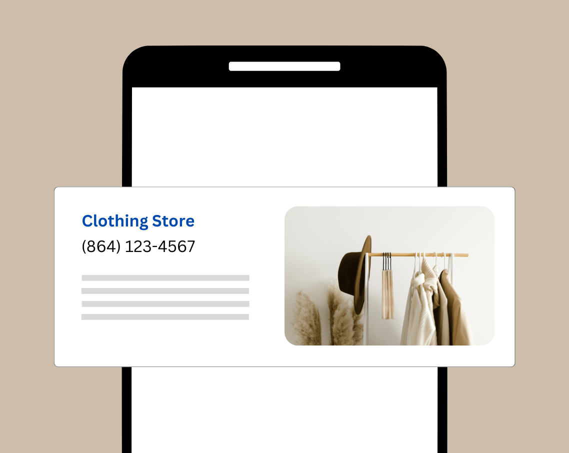 A cell phone with a picture of a clothing store on it.