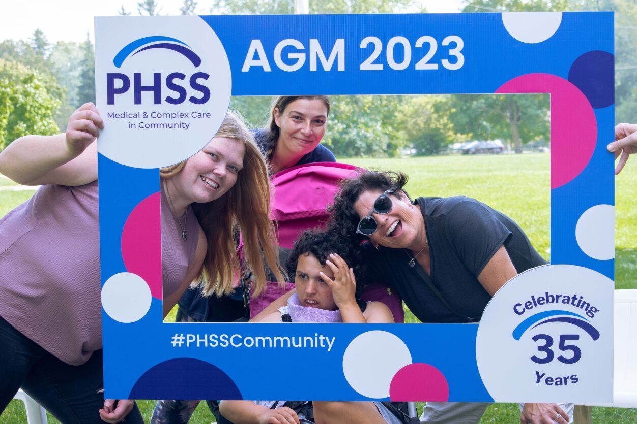 A group of people are posing for a picture in a photo frame.