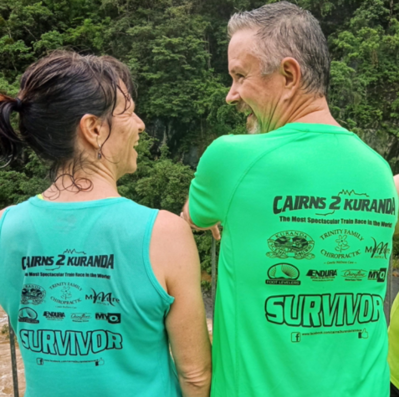 A Couple Of People Smiling At Each Other Showing The Back Of Their Shirts — Trinity Family Chiropractic In Cairns, QLD