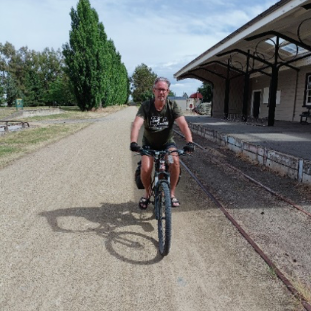 A Man On A Bike — Trinity Family Chiropractic In Cairns, QLD
