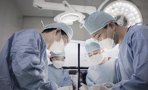 Surgical team performing implant surgery
