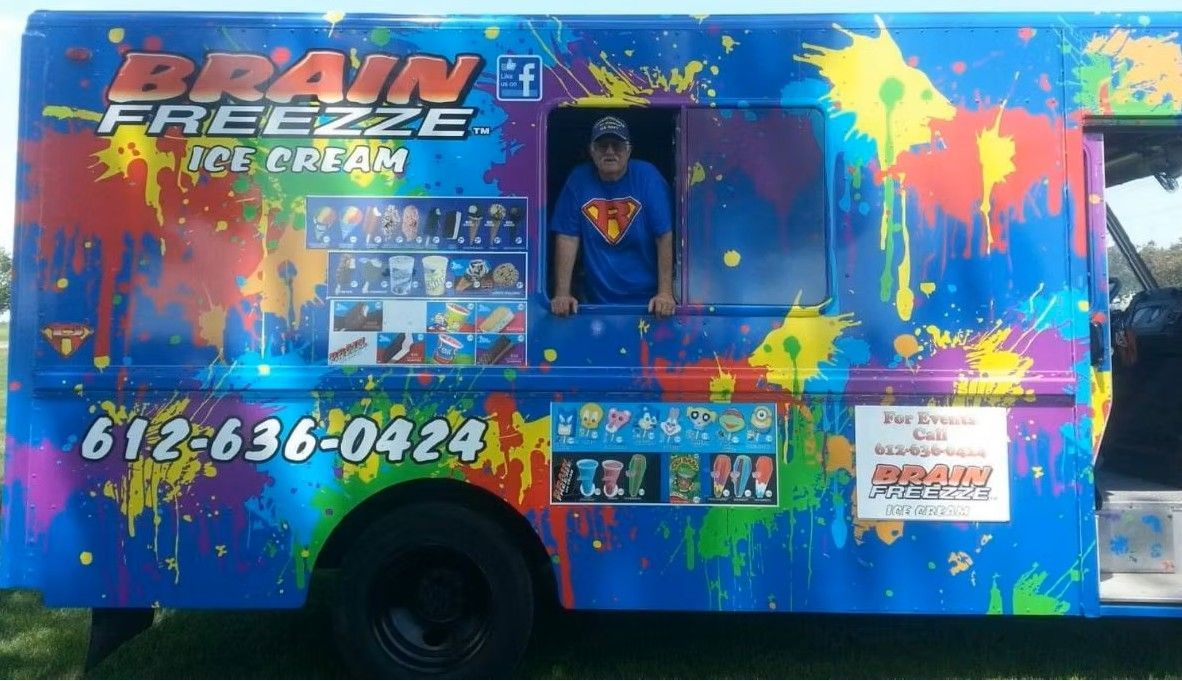 Colorful Brain Freeze shaved ice truck with serving window and menu graphics