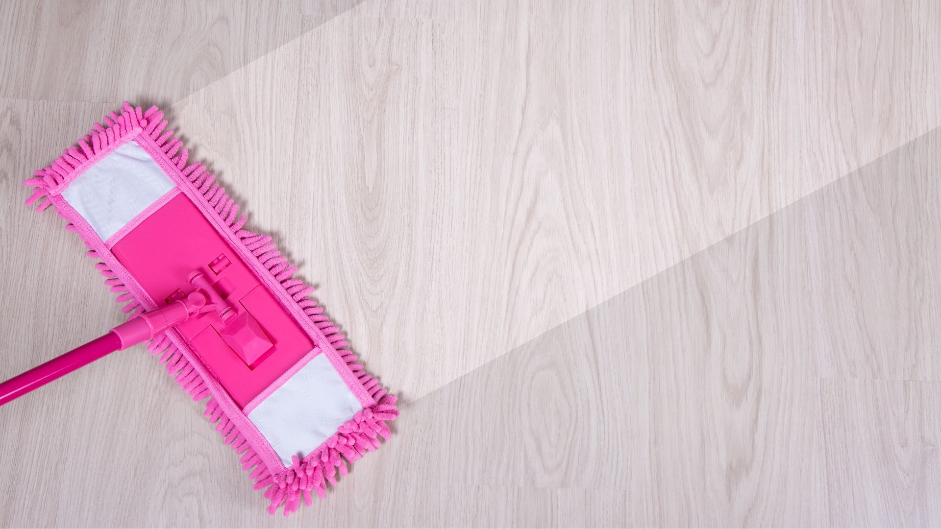 Moving out cleaning services running a mop over a laminate floor
