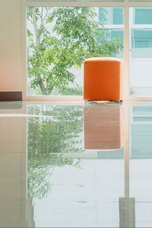 Orange Chair on a Tiled Floor — Floor and Windows in Dubbo, NSW