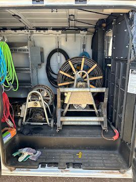 A white van for mr. wilson 's plumbing and drain solutions