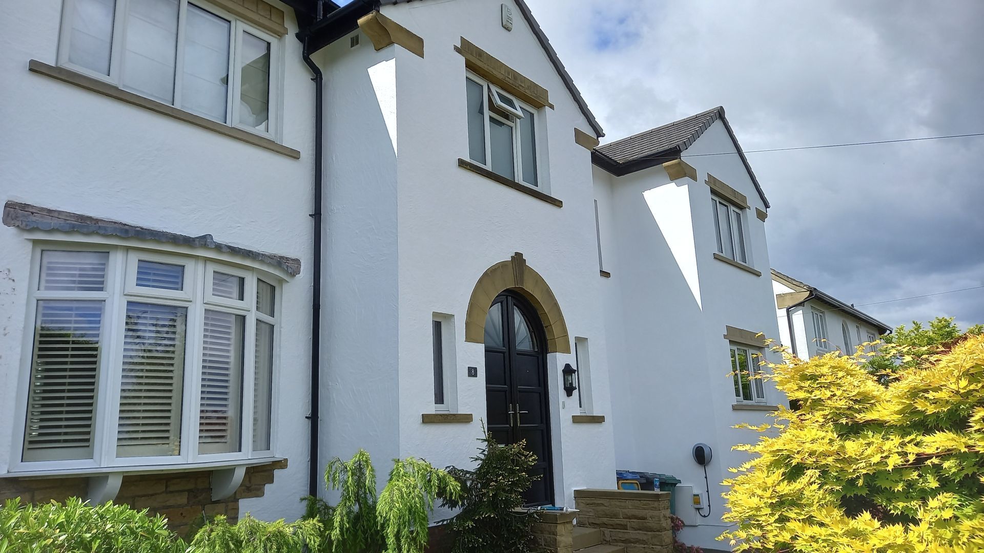 Residential exterior refresh – crisp white masonry paint applied with precision, enhancing period proportions and elegance