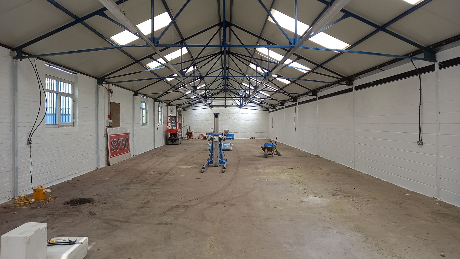 industrial - commercial - steelwork - blue - painting and decorating - breezeblock walls - white