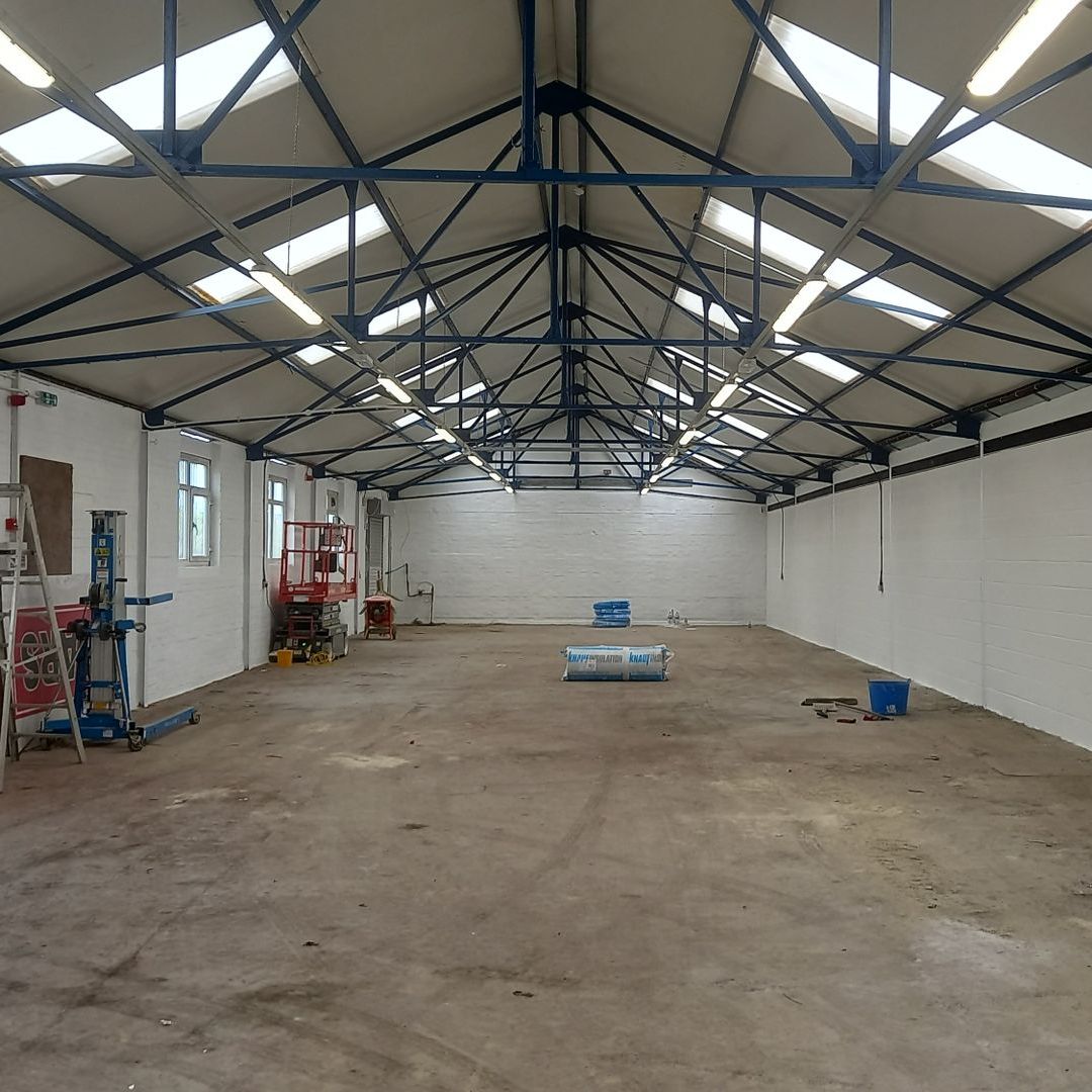 industrial - commercial - steelwork - blue - painting and decorating - breezeblock walls - white