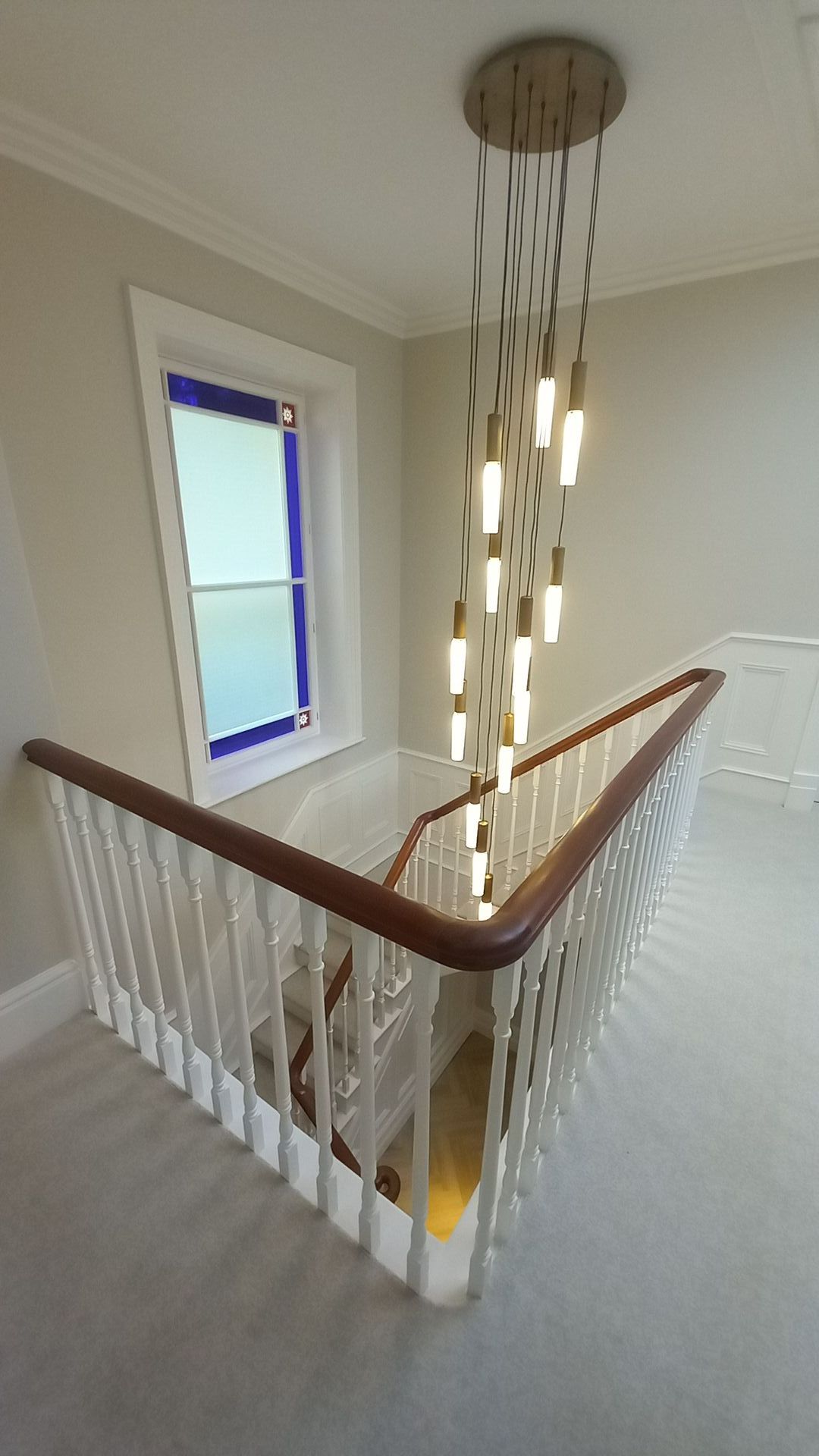 Heritage staircase in careful transformation – illuminated handrail and decorated sash window