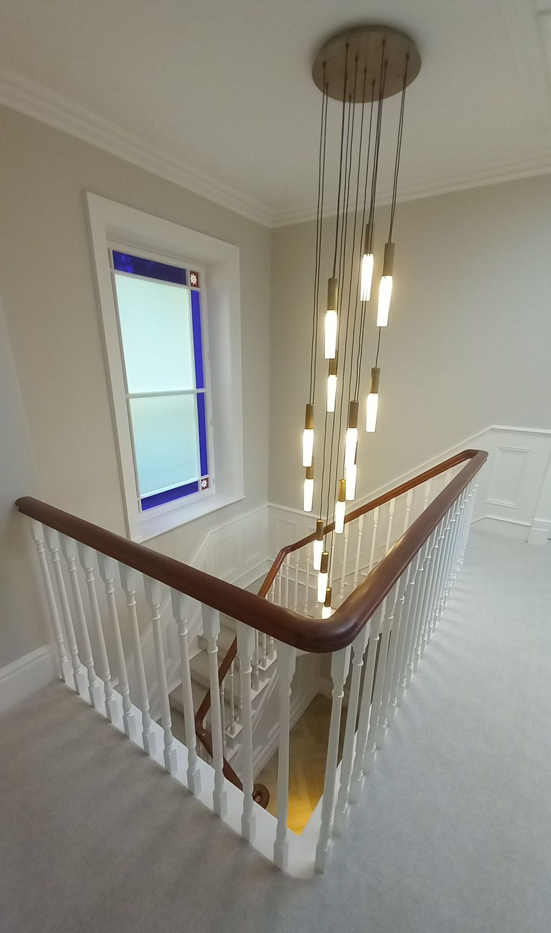 interior hallway painting and decorating - wood panelling - handrail - lighting