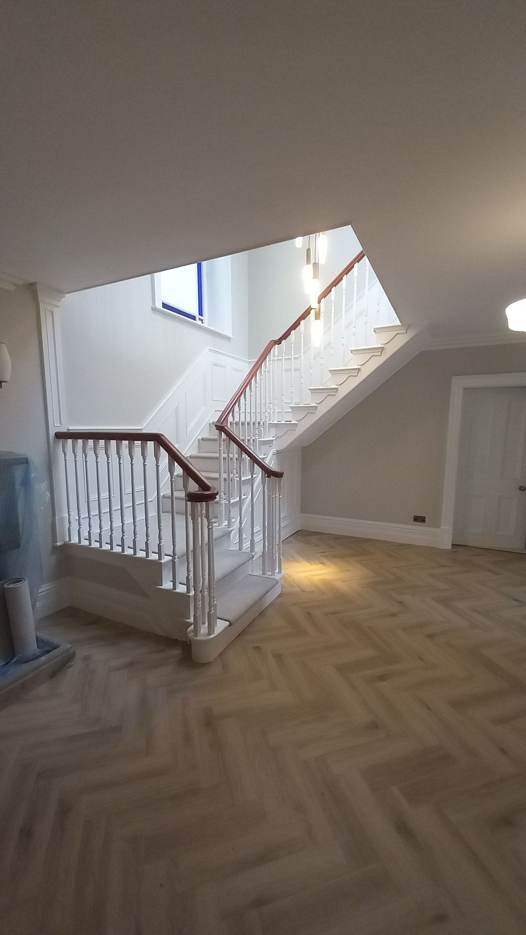 Interior grand hallway restoration, bespoke wood panelling - warm neutral tones for modern elegance