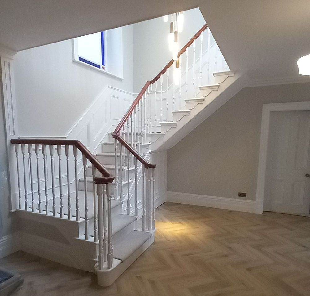interior hallway painting and decorating - wood panelling - handrail - lighting