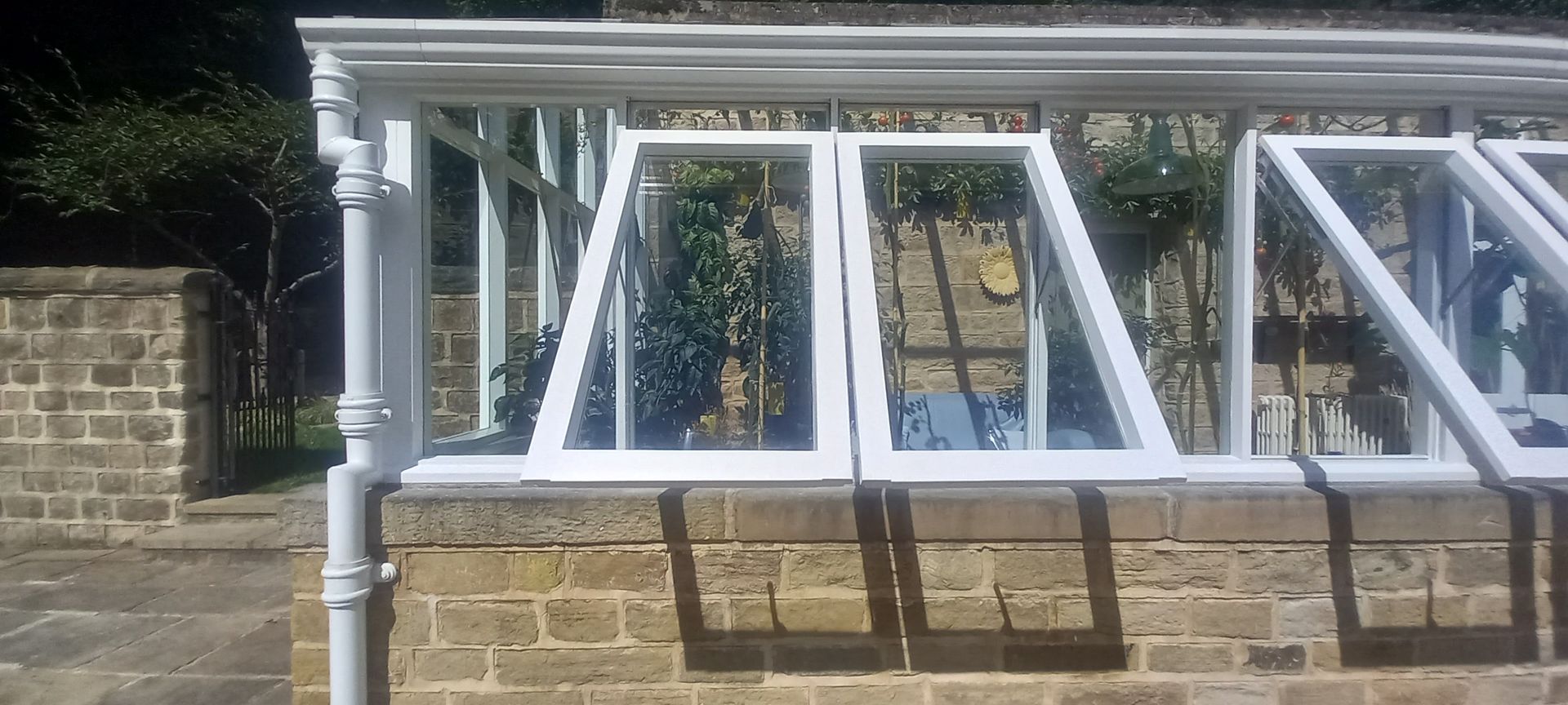 Maintenance on conservatory and pipework – minor wear addressed, protective coating applied to preserve crisp white finish