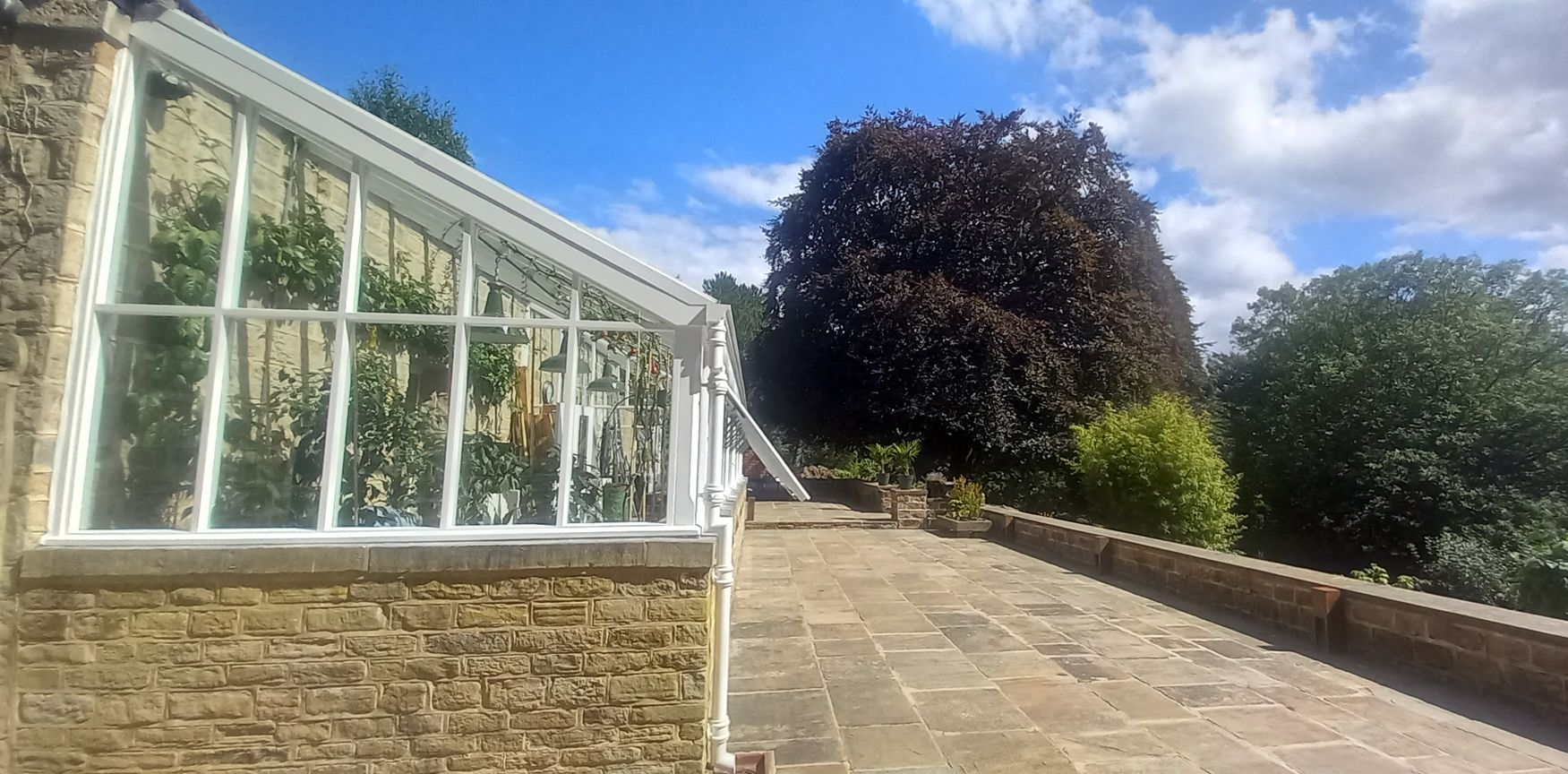 Routine maintenance refresh on heritage conservatory exterior – frames cleaned and recoated for weather protection