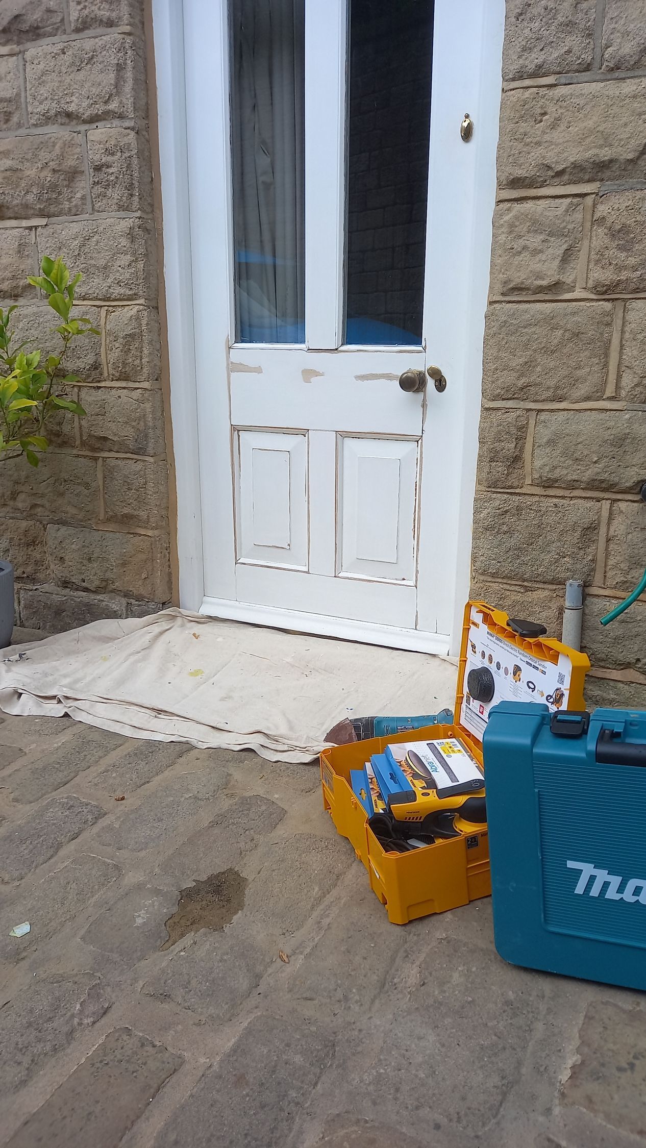 Thoughtful timber repairs complete on heritage external door – damaged areas patched and smoothed, ready for premium finish