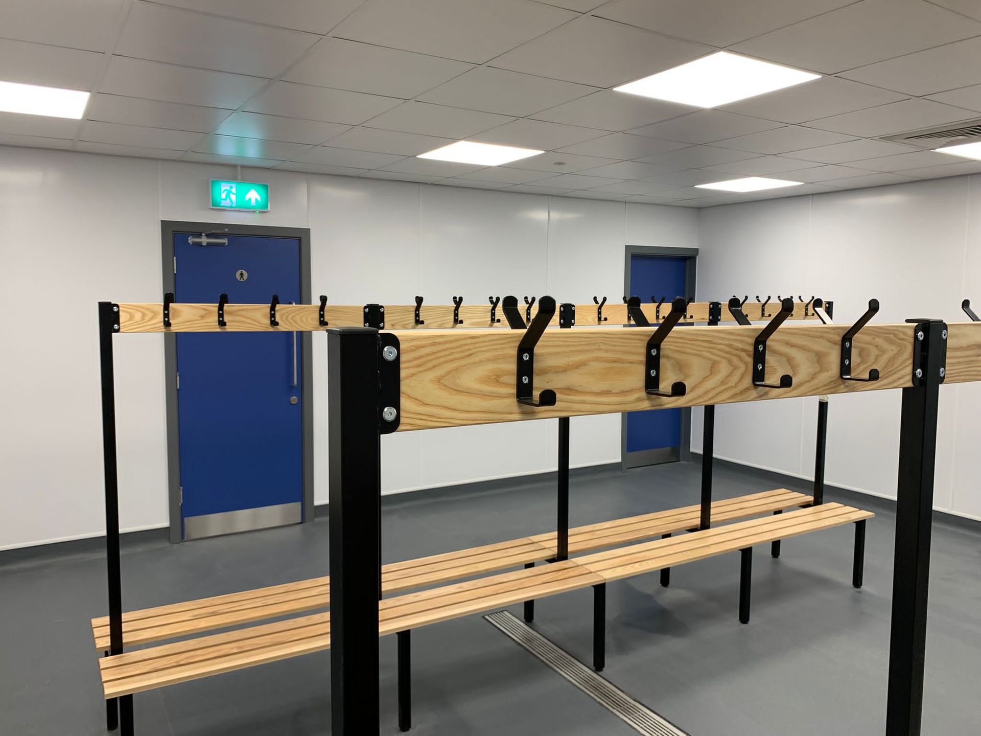 Education maintenance – painting of wooden bench supports, door frames and window surrounds 