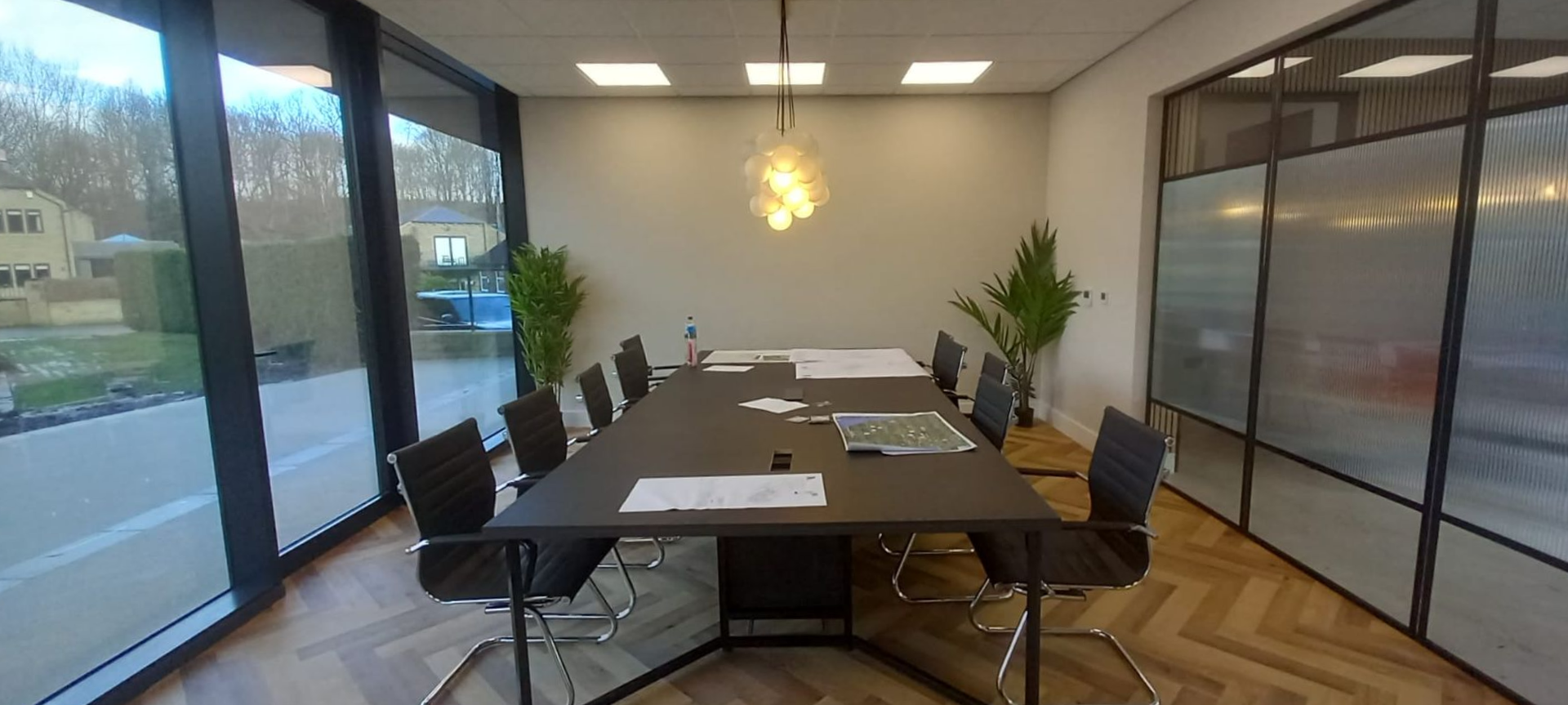 Office transformation – contemporary glass-walled boardroom and herringbone flooring complemented with premium finishes