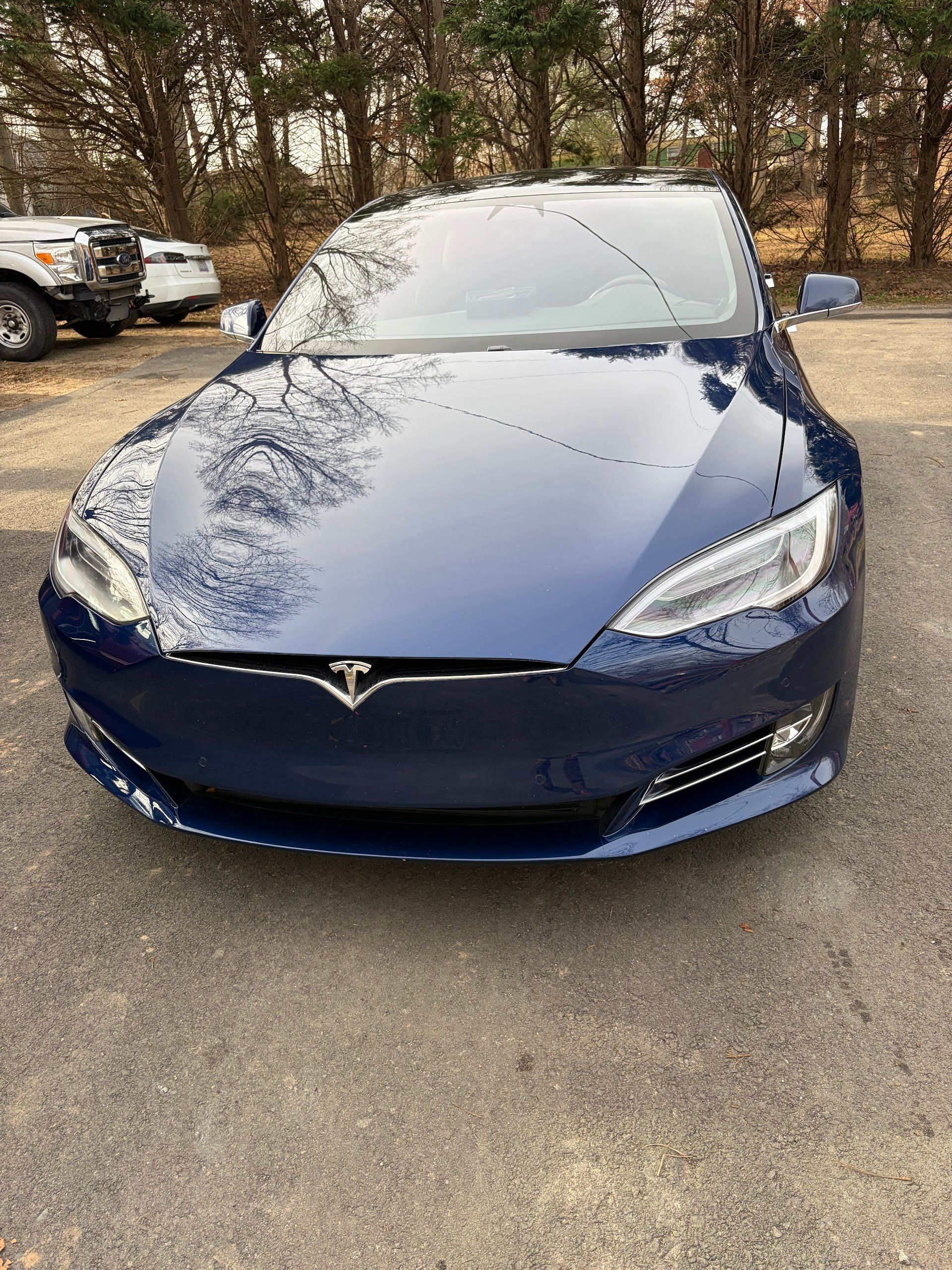Dark Blue Tesla Sedan Parked Outside | Pulse Automotive