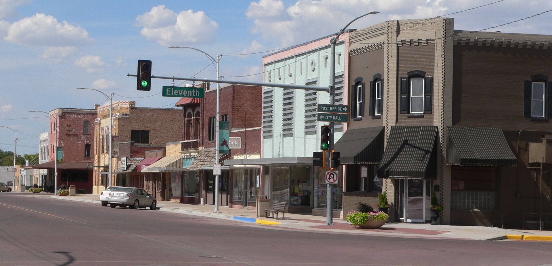 Weathercraft - Goodland, Kansas' Trusted Roofing Contractor A small town street with a green traffic light