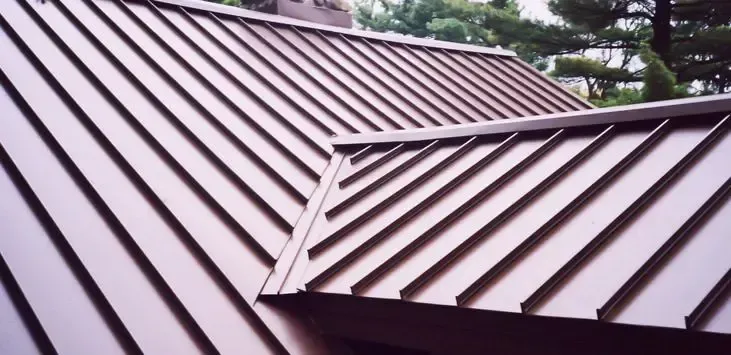 Standing Seam Panels A close up of a brown metal roof with a diagonal pattern