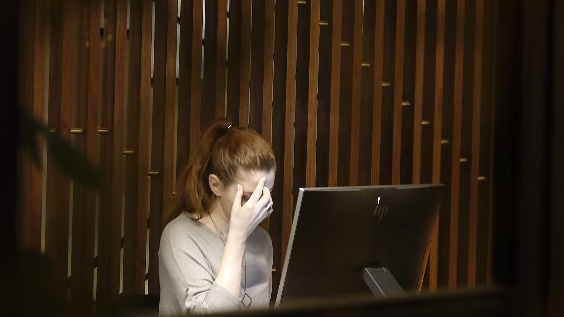 Business owner reviewing sexual harassment prevention policy and compliance documentation ahead of O