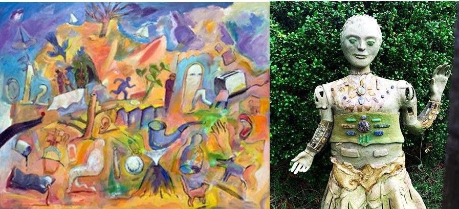A man with a beard is standing in front of three paintings on a wall.
