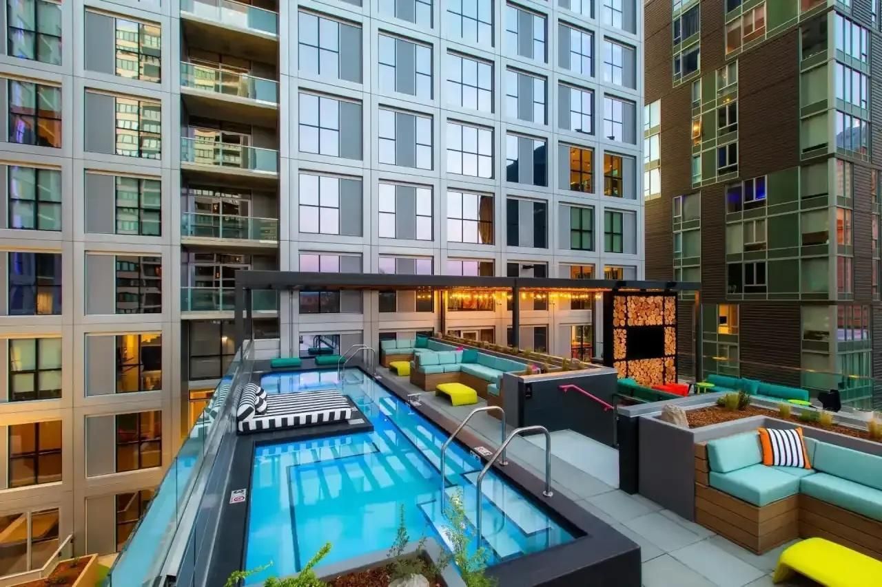 Rooftop lounge with seating and downtown city views at Collective on 4th apartments in Portland, OR