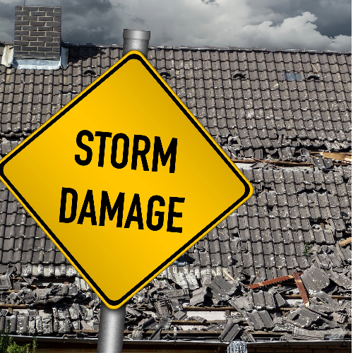 A yellow sign that says storm damage on it
