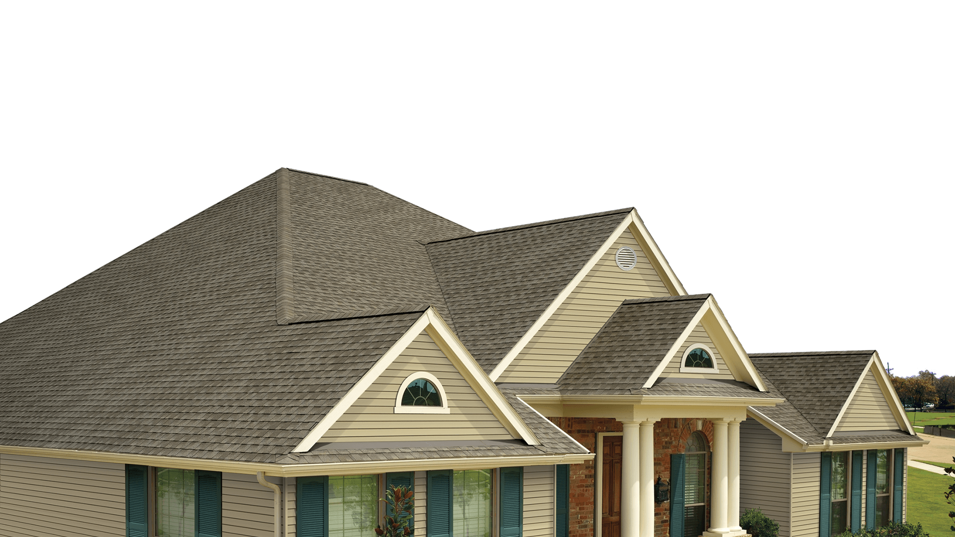A large house with a gray roof and blue shutters on a white background.