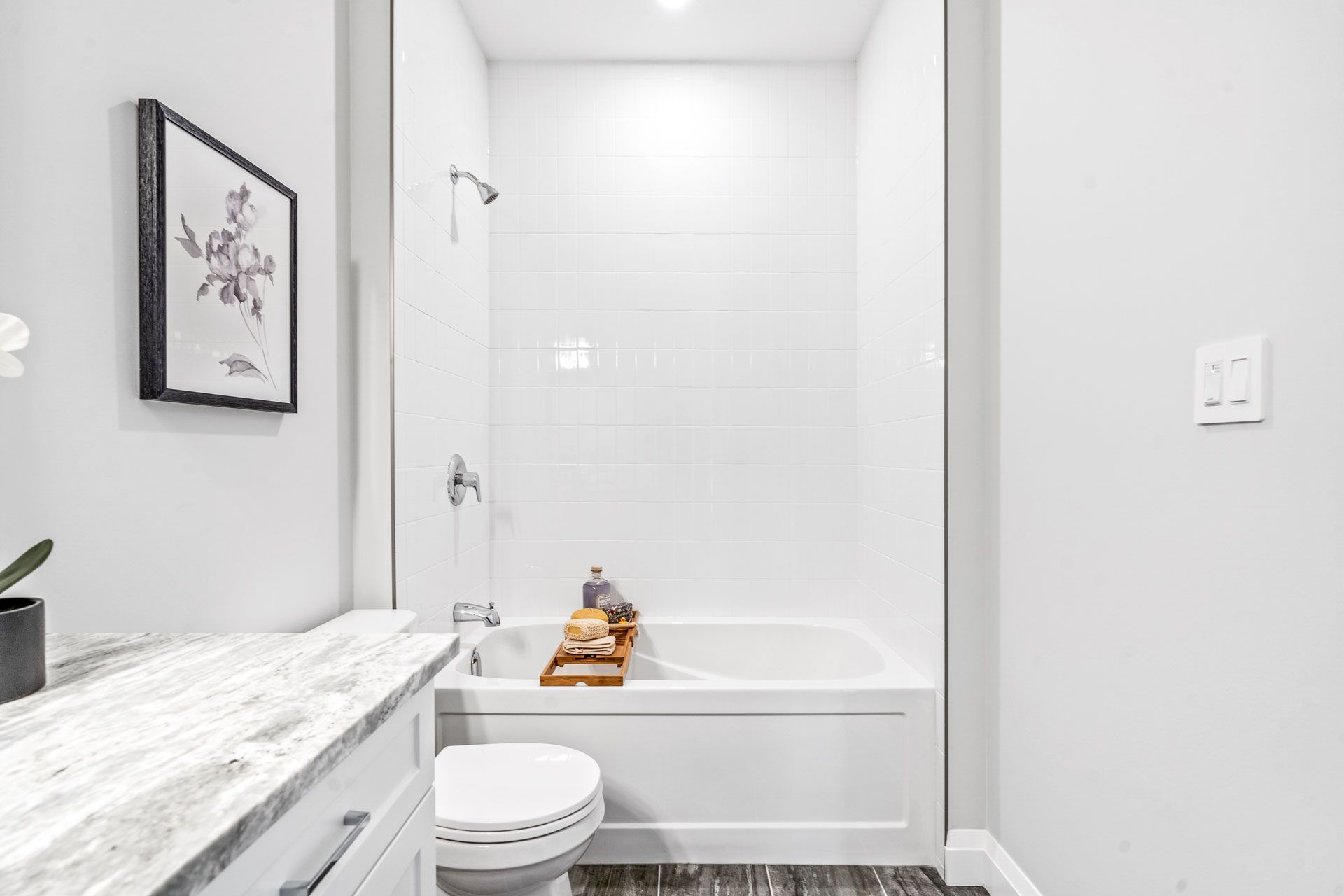 A bathroom with a tub, toilet , sink and shower in Brighton