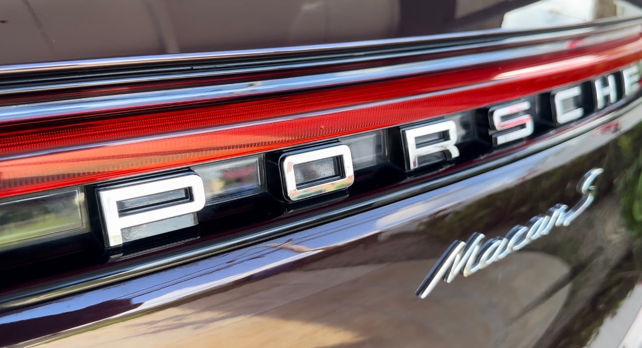 A close up of the rear end of a porsche macan s.